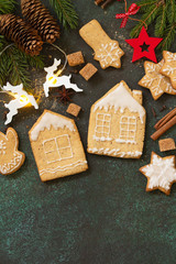 Christmas gingerbread cookies and ingredients for baking. Culinary background. Top view flat lay background with copy space.