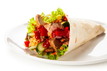 Kebab- grilled meat and vegetables wrapped in tortilla