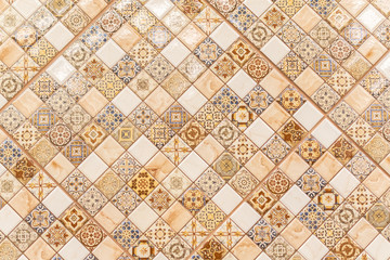 Ceramic tiles for decoration with ornament. Beige color. Background.