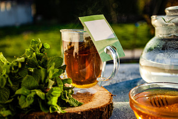 hot tea and honey in teacup outdoor