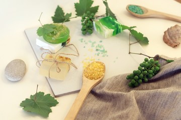 Natural soap, sea salt, grape branch, shells and stones on the table, spa procedures, body care, lifestyle