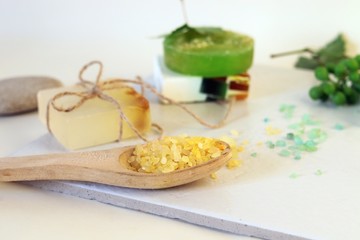Natural soap, sea salt, grape branch, shells and stones on the table, spa procedures, body care, lifestyle