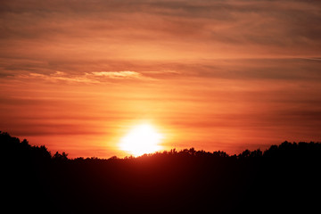 Fototapeta na wymiar Sunset is sunny, orange sky. Rural landscape