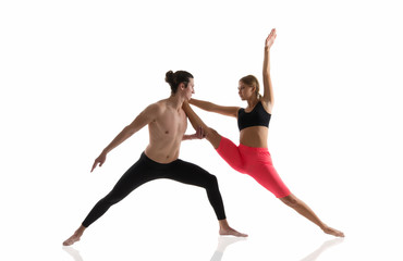 Fototapeta na wymiar Overall fitness. Couple of athletes isolated on white. Athletic man and woman perform pilates workout. Full body athletic class. Sexy sportsman and sportswoman. Athletic training. Athletic and strong