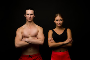 Fototapeta na wymiar Sports for all. Sexy fit couple black background. Professional sports team. Athletic man and woman keep muscular arms crossed. Taking sports to stay in shape. Physical training and sports