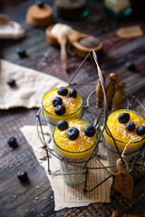 healthy layered dessert white chia seeds pudding, mango, blueberries
