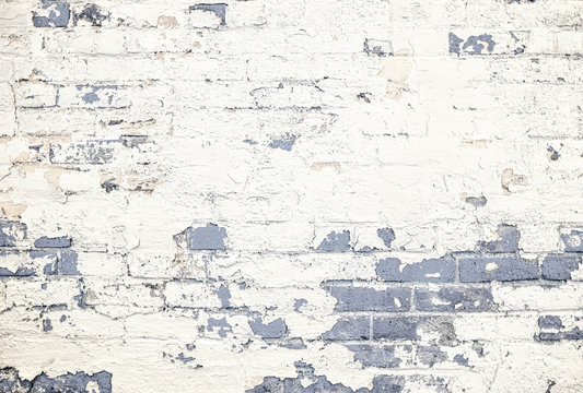 Tinted gray brick wall white peeling paint background