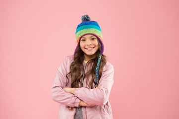 Cheerful and positive. warm clothes for cold season. kid fashion and shopping. trendy girl smiling. cheerful child pink background. happy childhood. small girl winter hat. ready for winter activity