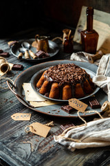 homemade chocolate cake with melted chocolate and chocolate flakes