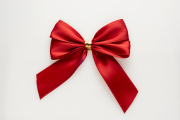 Gift red bow on white background