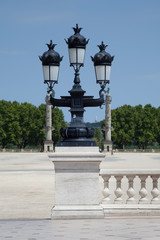 Fototapeta na wymiar Bordeaux street light effect with statues bordering the square of Quinconces