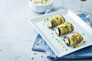 Rice pine nuts cilantro goat cheese stuffed eggplant rolls