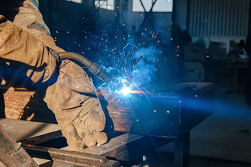 Semi-automatic welding with sparks and smoke