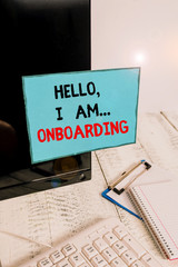 Writing note showing Hello I Am Onboarding. Business concept for telling demonstrating that you are on ship or plane Note paper taped to black computer screen near keyboard and stationary © Zofia