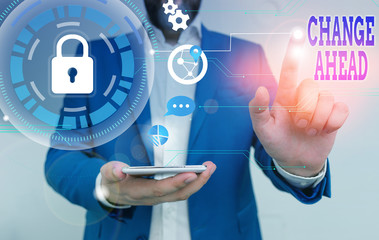 Conceptual hand writing showing Change Ahead. Concept meaning to replace with or exchange for another Become different Male human wear formal suit presenting using smart device