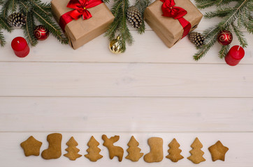 Christmas and New Year background. Composition of gifts, Christmas toys and branches, cones, and holiday cookies with copy space