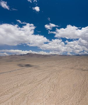 Vertical High Angle Shot Of The Desert Under The Amazing Clouds In The Sky Captured In California