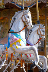 Fototapeta na wymiar white horses of old carrousel