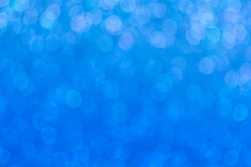 Abstract defocused blue lights bokeh background pattern