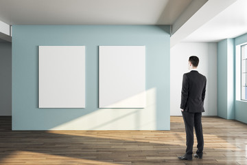 Businessman looking at two banner