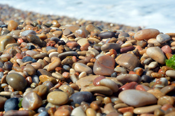 Background of marine pebbles smoothed by sea water.