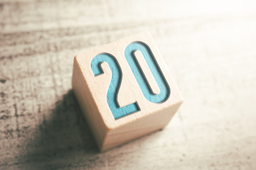 Number 20 On A Wooden Block On A Table