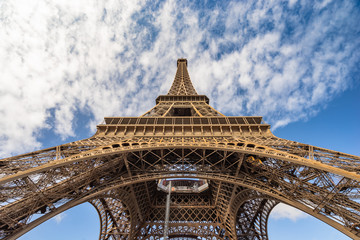 Fototapeta na wymiar Eiffel Tower in Paris frog view with blue sky and clouds