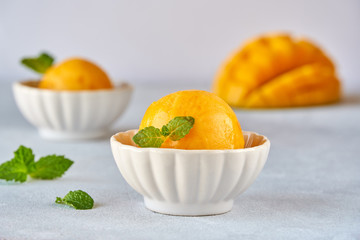 Mango ice cream sorbet with mint leaves and mango fruit - obrazy, fototapety, plakaty
