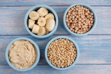 ingredients for making smoothies in bowls - banana, hummus, chickpea and pine nuts