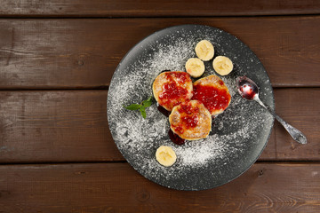 Cottage cheese pancakes on a dark plate