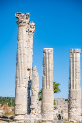 Fototapeta na wymiar With blue sky,Marble columns of Temple of Tyche, goddess of fortune, Roman, late first century AD, Olba, (Uzuncaburc), Silifke, Mersin,Turkey