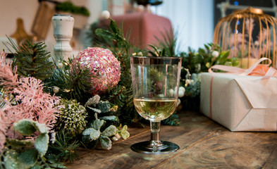 glass of champagne on a New Year's table with decorations
