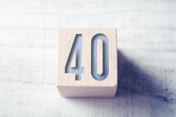Number 40 On A Wooden Block On A Table