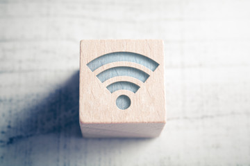 Macro Of A WIFI Icon On A Wooden Block On A Table