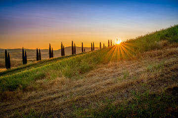 Sunrise over a hill. Travel destination Tuscany, Italy