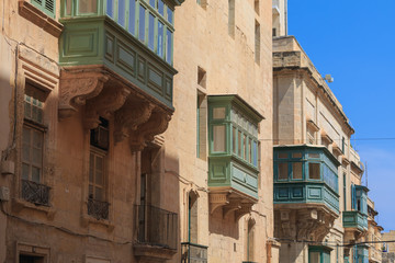 Fototapeta na wymiar Historical old colorful balconies in Valletta, Malta