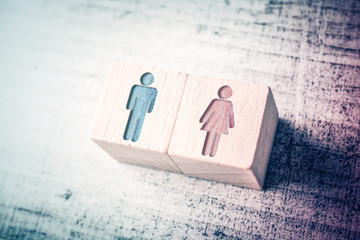 Gender Signs For Male And Female On Wooden Blocks On A Table