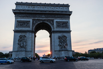 The Arc de Triomphe de l'Étoile in Paris at sunset