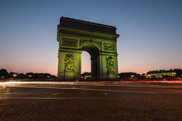 Fototapeta na wymiar The Arc de Triomphe de l'Étoile illuminated at night, Paris