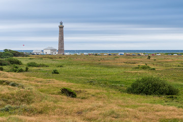 Fototapeta na wymiar Skagen Grey Lighthouse from 1858 placed at the northernmost point in Denmark with Kattegat in the background