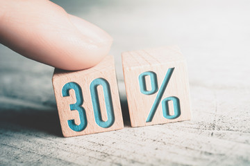 30 Percent Sale Discount Formed By Wooden Blocks And Arranged By A Female Finger On A Table
