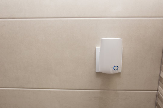 Wifi home repeater plugged in closeup.