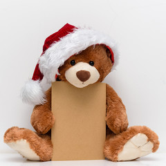 Christmas card with Teddy Bear.  With  holiday decoration and presents