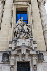 One of the allegorical sculpture groups at the facade of Grand Palais, Paris