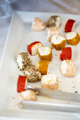 soft and creamy goat cheese seasoned with different spices