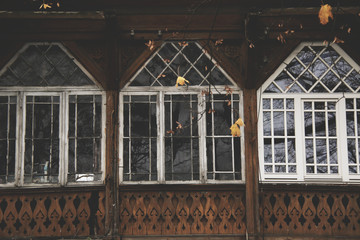 old wooden house with big windows - obrazy, fototapety, plakaty