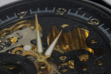 Mechanical skeleton watch on a white background