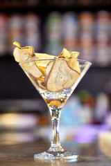 Chips from apples, pears and orange for decorating cocktails