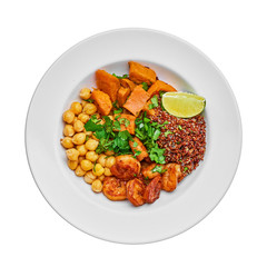 Delicious bowl with garlic grilled shrimps, sweet potato, quinoa, chickpeas, humus and lime isolated on a white background with space for text. Top view, above.