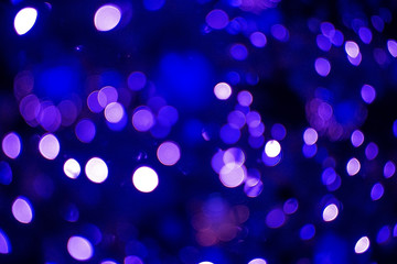 The glare of the holiday lights. Festive Christmas background.